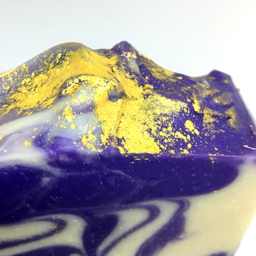 close up of gold mica on top of Planet Yum's Alchemy goat milk soap