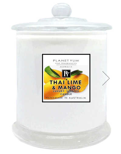 Picture of candle glass with label Thai Lime & Mango Luxury scented candle by Planet Yum