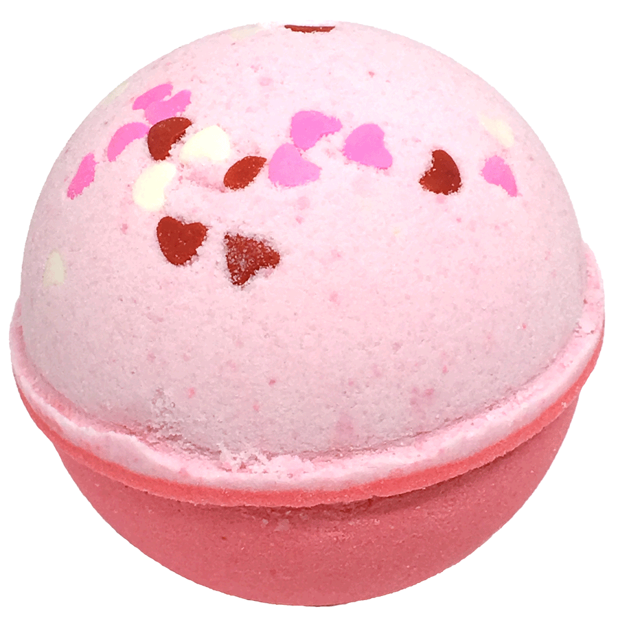 Pink & Red bath bomb with candy hearts on top called Love Spell by Planet Yum on white background